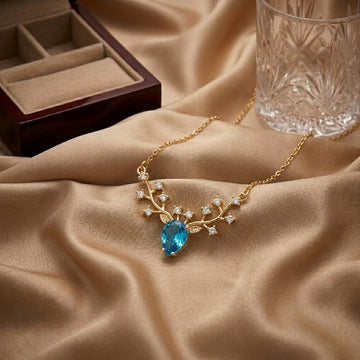 Azure Blossom Branch Necklace with Blue Topaz Crystal