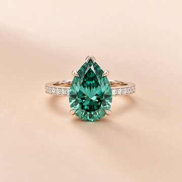 Emerald Teardrop Solitaire Ring with Zircon Band